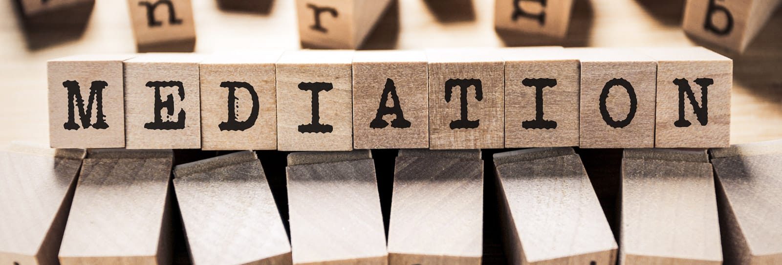 Wooden blocks spelling the word mediation